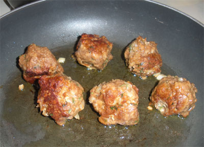Frying up some delicious vegetarian meatballs.