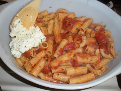 Layer the pasta and cheese in a casserole dish.